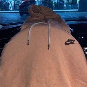 Peach colored Nike hoodie